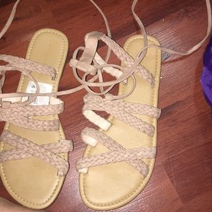 Pink gladiator sandals .